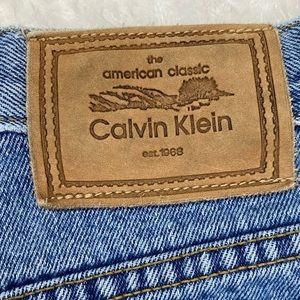 Calvin Klein blue jeans size 10, front zip button fly